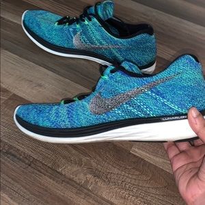 Blue reflective Nike running shoes